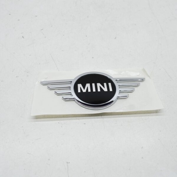 51149447806 - NEW MINI CLUBMAN F54 FRONT BONNET HOOD BADGE 51149447806 ORIGINAL