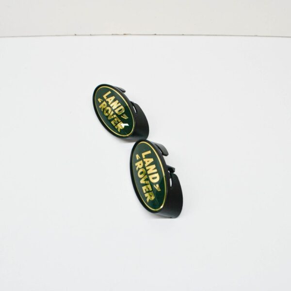 DAS100150 - LAND ROVER DEFENDER Pick-up 110 Front Grill Emblem DAS100150 NEW Original