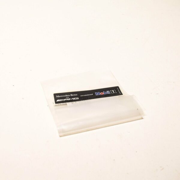 A0045849438 - Genuine Mercedes-Benz AMG logo mobile 1 oil sticker labels A0045849438