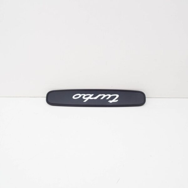 99655130500A03 - Porsche 911 996 rear trim "Turbo" logo black 99655130500A03 NEW ORIGINAL