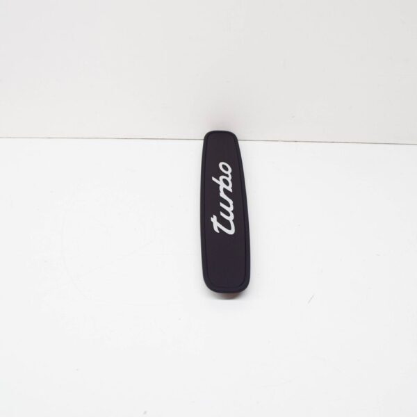 99655130500A03 - Porsche 911 996 rear trim "Turbo" logo black 99655130500A03 NEW ORIGINAL