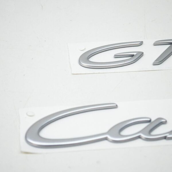 99755903706 - Porsche 911 997 Carrera GTS tailgate emblem 99755903706 NEW ORIGINAL