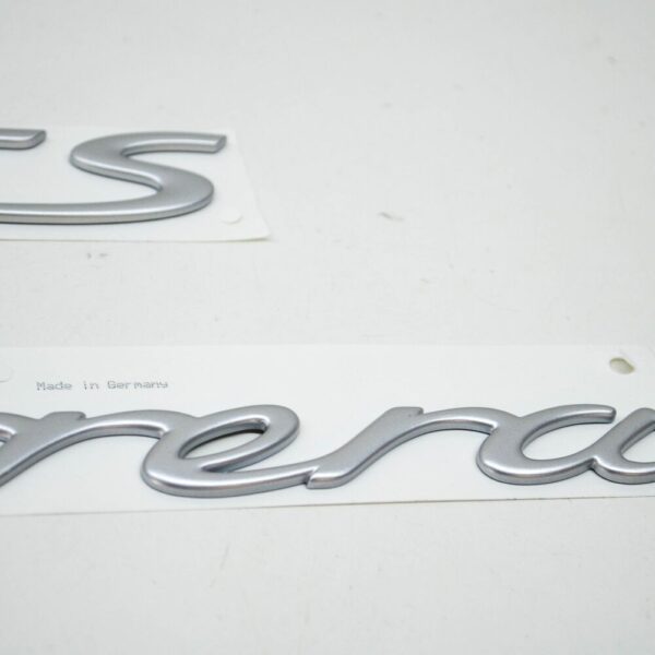 99755903706 - Porsche 911 997 Carrera GTS tailgate emblem 99755903706 NEW ORIGINAL